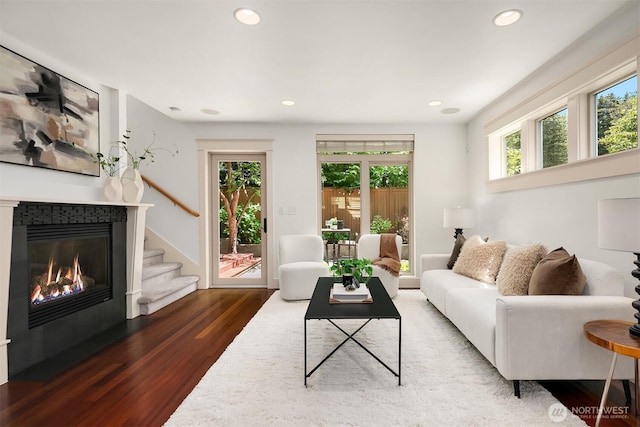3122 Franklin Ave E Unit A, Seattle, WA 98102 - living area with healthy amount of natural light, wood finished floors, a glass covered fireplace, and recessed lighting