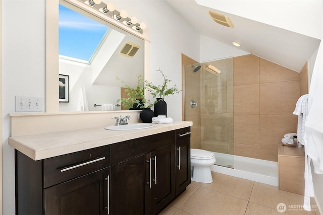3122 Franklin Ave E Unit A, Seattle, WA 98102 - bathroom with vaulted ceiling, vanity, toilet, walk in shower, and tile patterned flooring