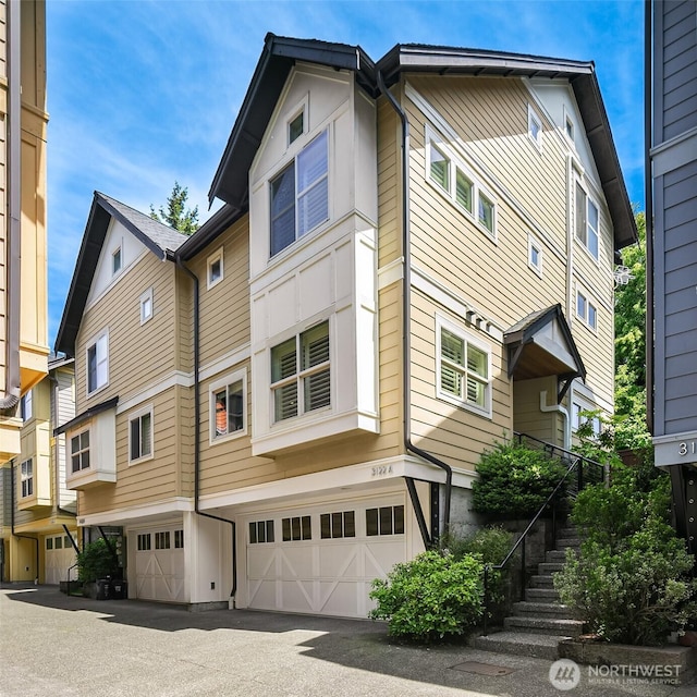 3122 Franklin Ave E Unit A, Seattle, WA 98102 - back of property featuring a garage and stairway