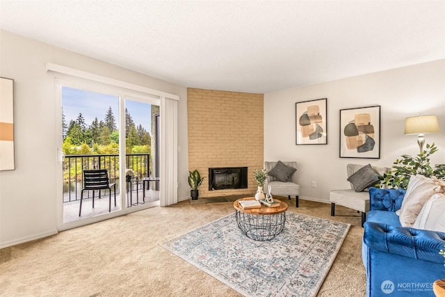 615 75th St SE Unit C-44, Everett, WA 98203 - living area featuring carpet flooring, a brick fireplace, and baseboards