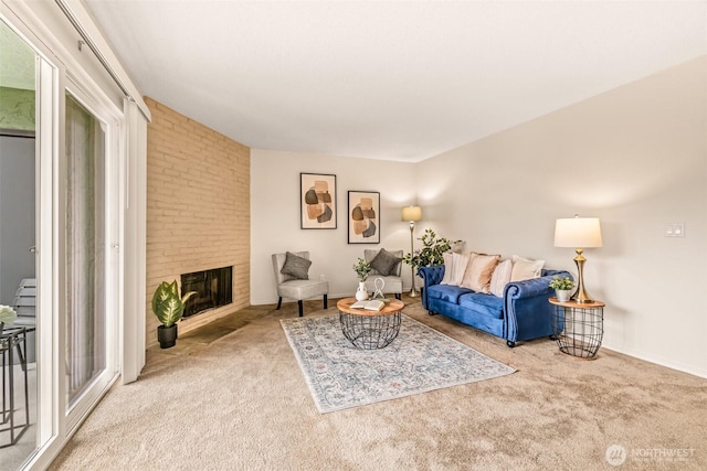 615 75th St SE Unit C-44, Everett, WA 98203 - living room with carpet, a fireplace, and baseboards