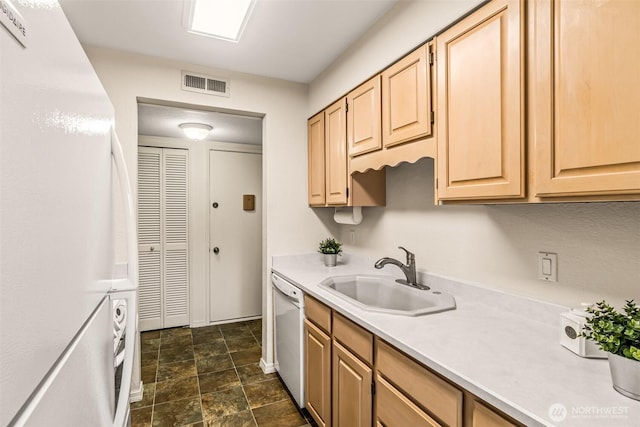 615 75th St SE Unit C-44, Everett, WA 98203 - kitchen with a sink, white appliances, light countertops, light brown cabinetry, and stone finish floors