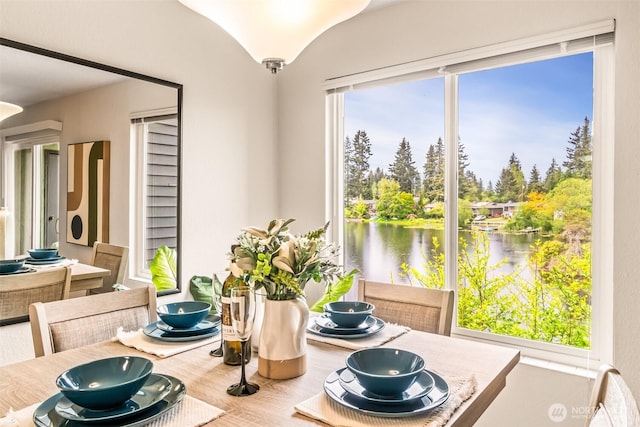 615 75th St SE Unit C-44, Everett, WA 98203 - dining space featuring a water view and wood finished floors