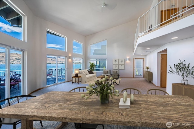 4270 US Highway 97a, Chelan, WA 98816 - dining room featuring carpet, a towering ceiling, and plenty of natural light