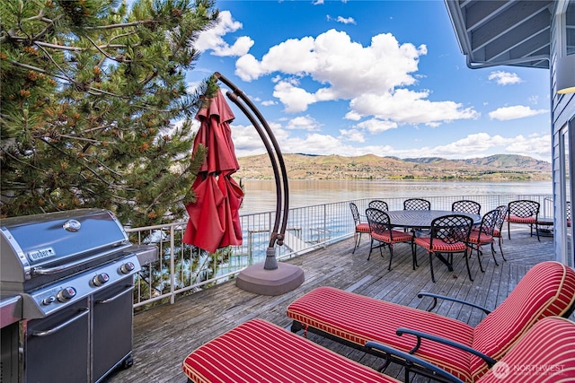 4270 US Highway 97a, Chelan, WA 98816 - deck with grilling area, a water and mountain view, and outdoor dining area