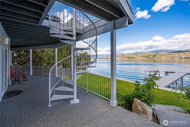 4270 US Highway 97a, Chelan, WA 98816 - view of patio / terrace with stairway, a water view, and a dock