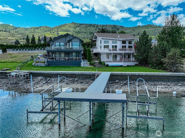 4270 US Highway 97a, Chelan, WA 98816 - back of house with boat lift, a water and mountain view, and a balcony