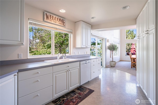 4270 US Highway 97a, Chelan, WA 98816 - kitchen with white dishwasher, a sink, white cabinetry, recessed lighting, and finished concrete floors