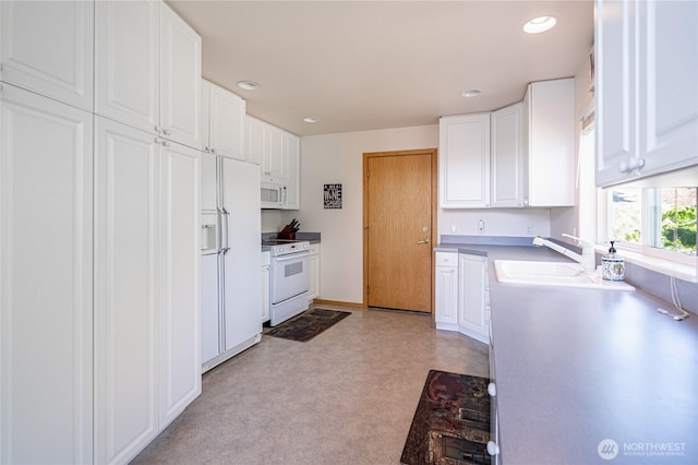 4270 US Highway 97a, Chelan, WA 98816 - kitchen with white appliances, white cabinets, recessed lighting, and a sink