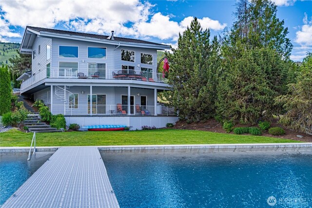 4270 US Highway 97a, Chelan, WA 98816 - rear view of house with stairway, a yard, and a water view