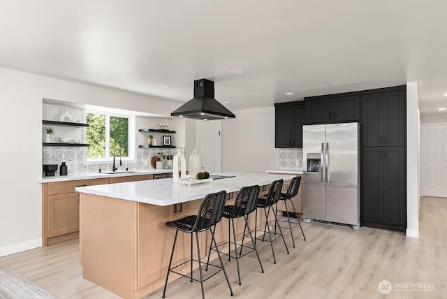 11433 SE 244th St, Kent, WA 98030 - kitchen with stainless steel fridge with ice dispenser, exhaust hood, open shelves, a sink, and light wood-type flooring