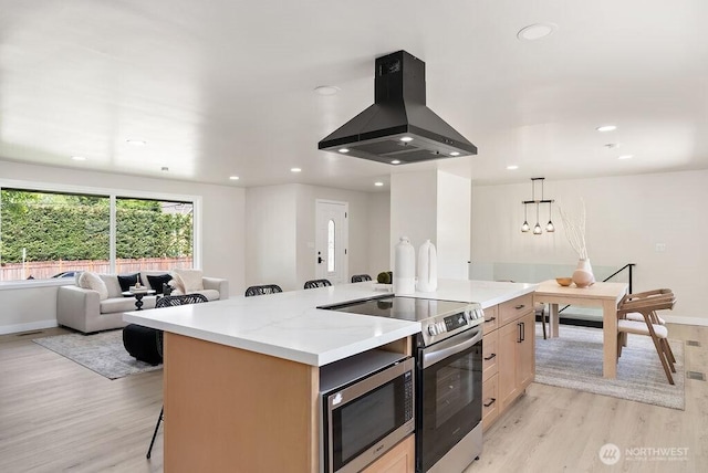 11433 SE 244th St, Kent, WA 98030 - kitchen featuring island range hood, appliances with stainless steel finishes, open floor plan, light wood-style flooring, and a kitchen island