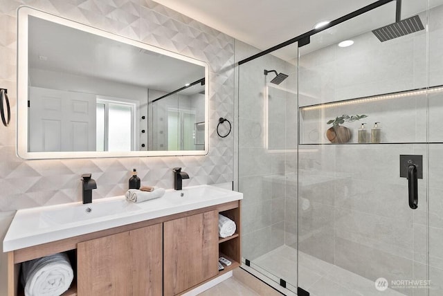 11433 SE 244th St, Kent, WA 98030 - bathroom with tile walls, a shower stall, double vanity, and decorative backsplash