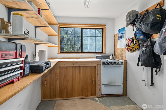 622 Wagon Wheel Rd, Cle Elum, WA 98922 - kitchen with white range, concrete floors, and brown cabinets