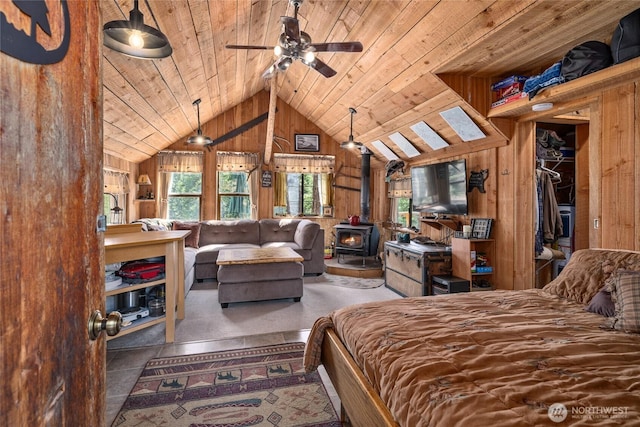 622 Wagon Wheel Rd, Cle Elum, WA 98922 - bedroom featuring wooden ceiling, wooden walls, a wood stove, and vaulted ceiling