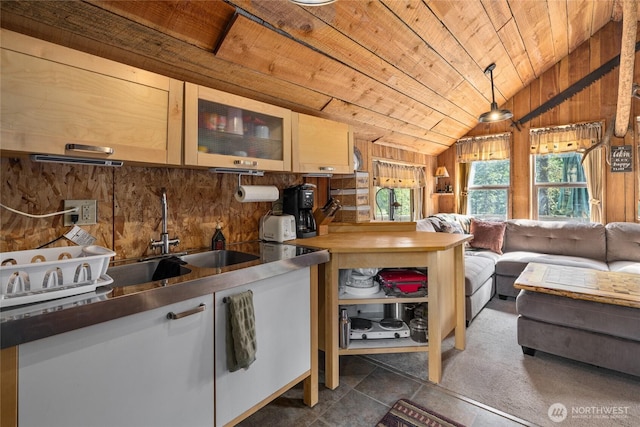 622 Wagon Wheel Rd, Cle Elum, WA 98922 - kitchen with wood ceiling, vaulted ceiling, wood walls, a sink, and glass insert cabinets
