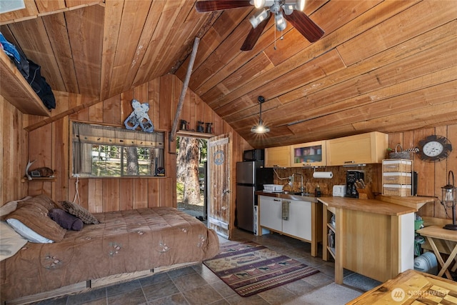 622 Wagon Wheel Rd, Cle Elum, WA 98922 - kitchen with wood ceiling, wooden walls, freestanding refrigerator, lofted ceiling, and ceiling fan