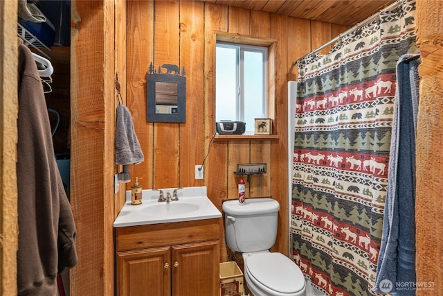 622 Wagon Wheel Rd, Cle Elum, WA 98922 - bathroom with wooden walls, vanity, wood ceiling, and toilet