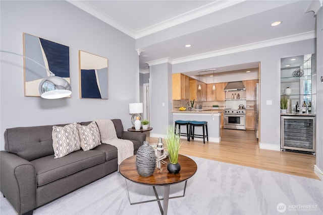 177 107th Ave NE Unit 2401, Bellevue, WA 98004 - living room featuring wine cooler, crown molding, light wood-style flooring, recessed lighting, and bar