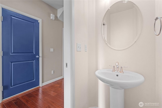 317 Phoenix Ave SW, Orting, WA 98360 - bathroom with wood finished floors and baseboards