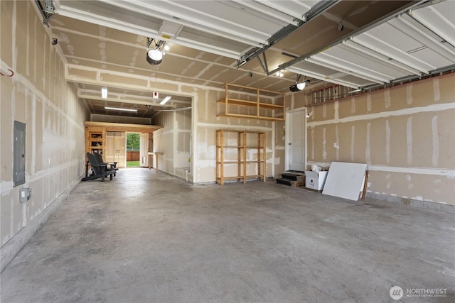 317 Phoenix Ave SW, Orting, WA 98360 - garage featuring electric panel and a garage door opener