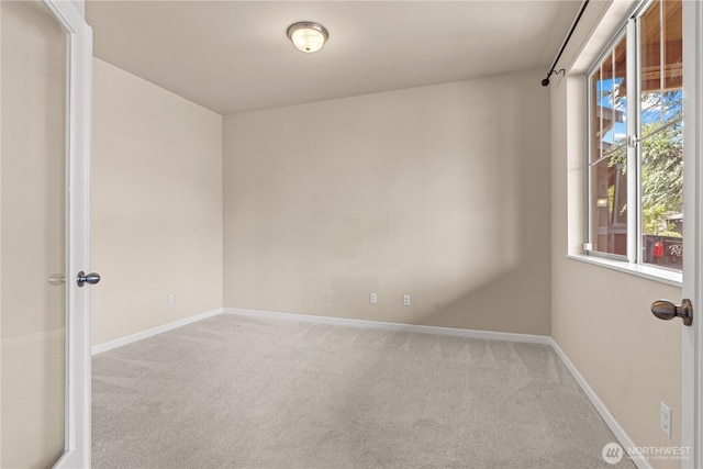 317 Phoenix Ave SW, Orting, WA 98360 - unfurnished room with carpet and baseboards