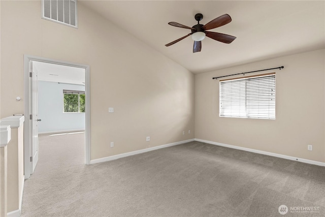 317 Phoenix Ave SW, Orting, WA 98360 - unfurnished room with vaulted ceiling, carpet floors, ceiling fan, and baseboards