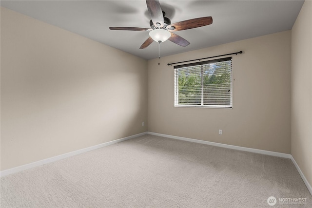 317 Phoenix Ave SW, Orting, WA 98360 - unfurnished room featuring baseboards, ceiling fan, and light colored carpet