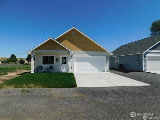 516 E Alder, Ritzville, WA 99169 - ranch-style home with concrete driveway, a garage, and a front yard