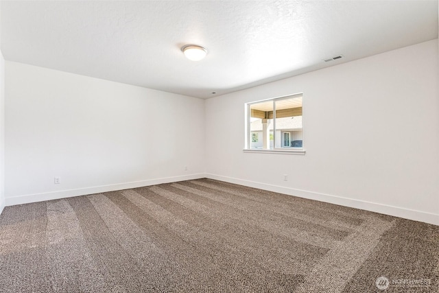 217 N Sandy Loop, Moses Lake, WA 98837 - spare room with dark colored carpet