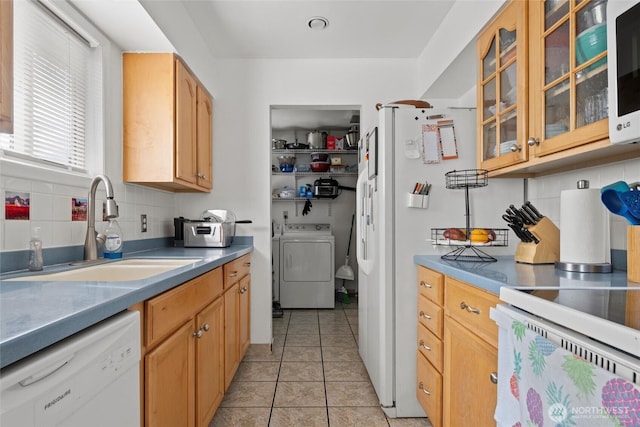 1223 Arnold Dr, Moses Lake, WA 98837 - kitchen with white appliances, a sink, backsplash, glass insert cabinets, and light tile patterned flooring