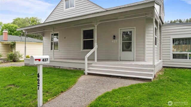 427 E Dayton Ave, Dayton, WA 99328 - view of front of property with covered porch and a front lawn