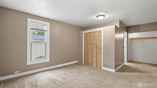 427 E Dayton Ave, Dayton, WA 99328 - unfurnished bedroom with carpet floors and a textured ceiling