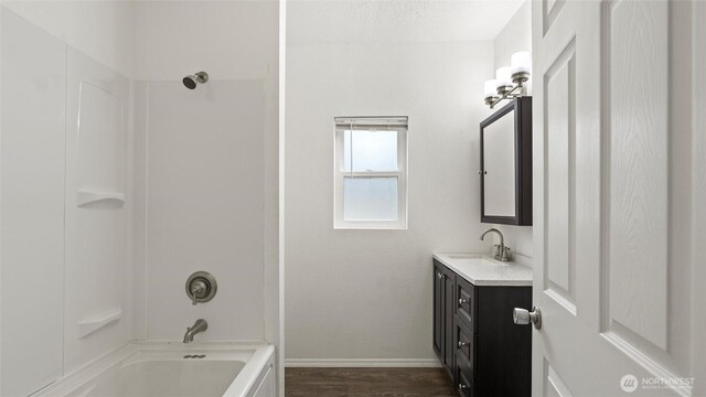 427 E Dayton Ave, Dayton, WA 99328 - full bath featuring vanity, baseboards,  shower combination, and wood finished floors