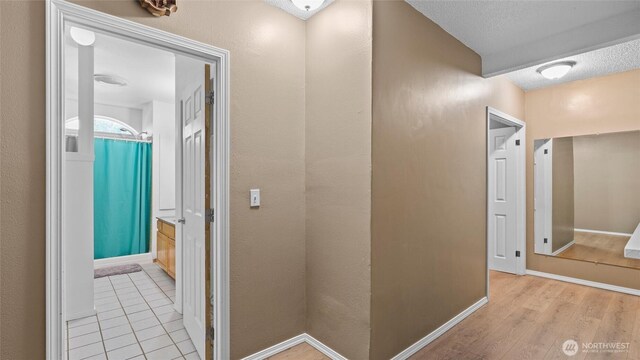 427 E Dayton Ave, Dayton, WA 99328 - corridor featuring baseboards and light wood-style floors