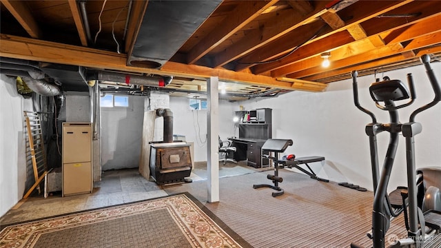 427 E Dayton Ave, Dayton, WA 99328 - basement featuring a wood stove and heating unit