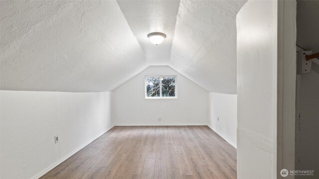 427 E Dayton Ave, Dayton, WA 99328 - bonus room with a textured ceiling, wood finished floors, lofted ceiling, and baseboards