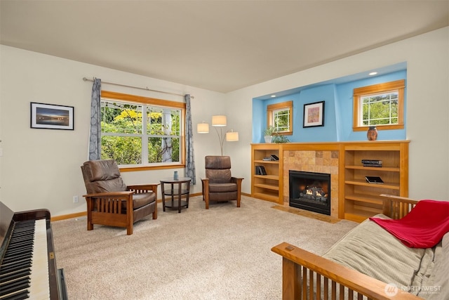 6570 Cedar Glade Ln, Bainbridge Island, WA 98110 - living area featuring healthy amount of natural light, a tiled fireplace, carpet floors, and recessed lighting