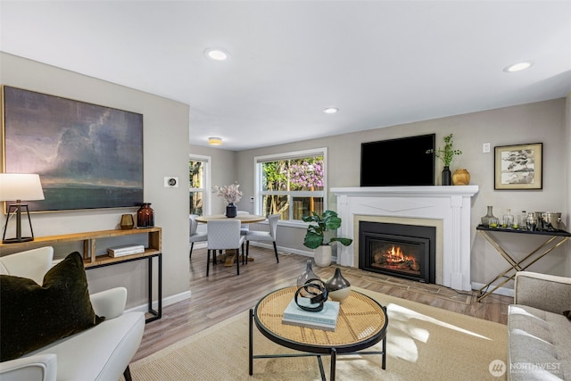 14011 Wallingford Ave N, Seattle, WA 98133 - living room with a glass covered fireplace, wood finished floors, recessed lighting, and baseboards
