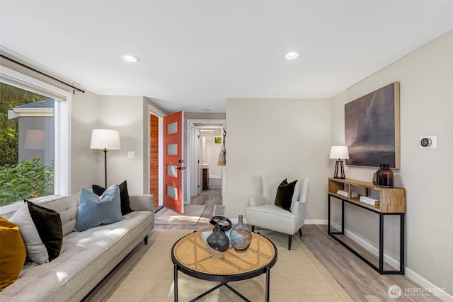 14011 Wallingford Ave N, Seattle, WA 98133 - living area with light wood-style flooring, recessed lighting, and baseboards