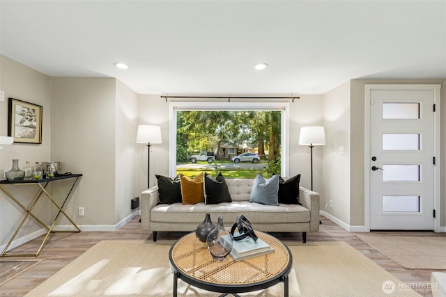 14011 Wallingford Ave N, Seattle, WA 98133 - living room with baseboards, wood finished floors, and recessed lighting