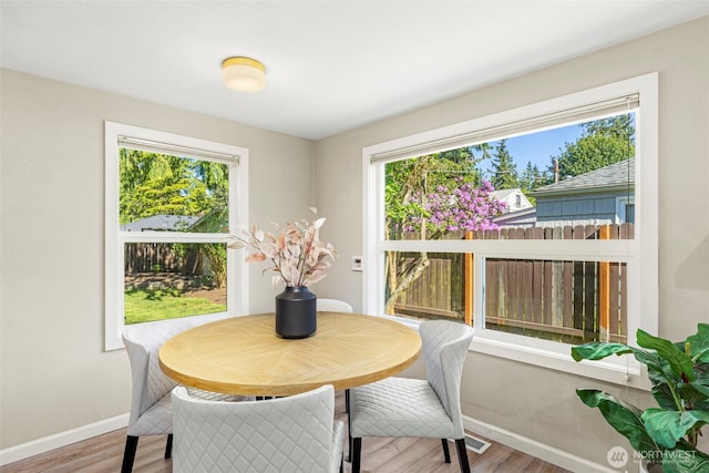 14011 Wallingford Ave N, Seattle, WA 98133 - dining space with baseboards, wood finished floors, and healthy amount of natural light