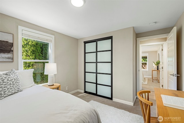 14011 Wallingford Ave N, Seattle, WA 98133 - bedroom featuring baseboards and light colored carpet