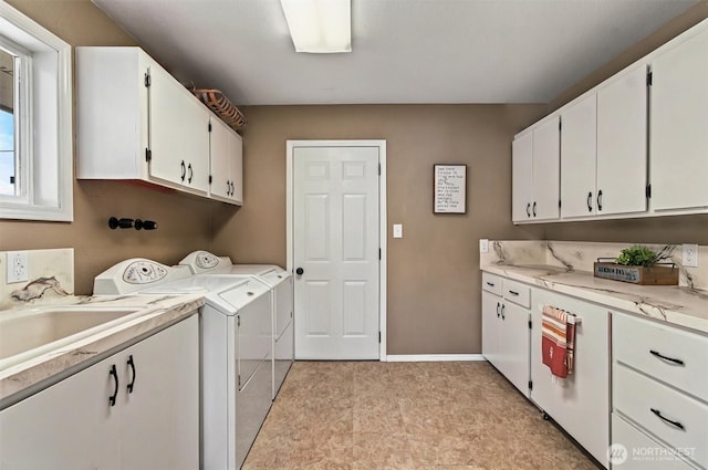 293 State Route 409, Cathlamet, WA 98612 - laundry area with cabinet space, separate washer and dryer, and baseboards