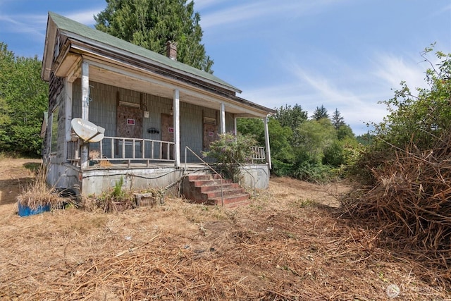 1908 W State Route 4 Unit 1, Skamokawa, WA 98647 - view of front facade featuring a porch and a chimney