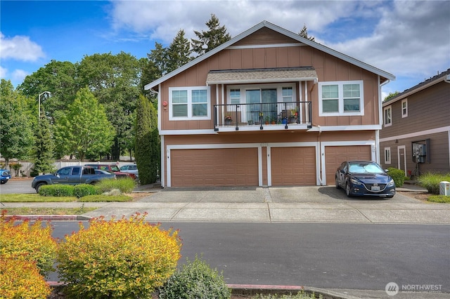 6018 Illinois Ln SE Unit B, Lacey, WA 98513 - view of front of property with concrete driveway, a garage, board and batten siding, and a balcony