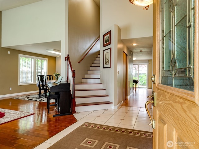 1717 24th Ave Court SE, Puyallup, WA 98374 - foyer with a towering ceiling, baseboards, stairs, and tile patterned flooring