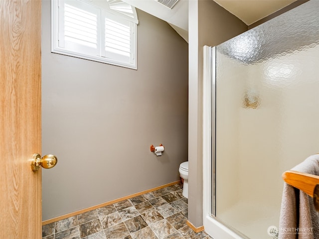 1717 24th Ave Court SE, Puyallup, WA 98374 - bathroom with baseboards, a stall shower, toilet, and stone finish floors
