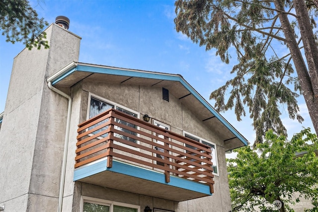 6710 24th Ave NW, Seattle, WA 98117 - view of property exterior with a balcony and stucco siding
