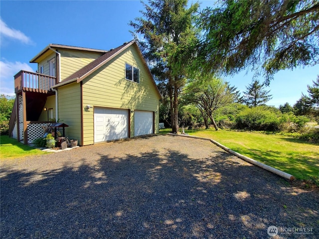 248 Ensign Ave NW, Ocean Shores, WA 98569 - view of property exterior featuring a lawn, driveway, and an attached garage